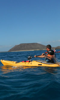 Sea Kayak with Lobos Island Fuerteventura in background Sea Kayak with Lobos Island Fuerteventura in background