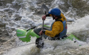 Paddler on White Water in Green Kayak