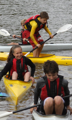 Young paddlers wearing buoyancy aids