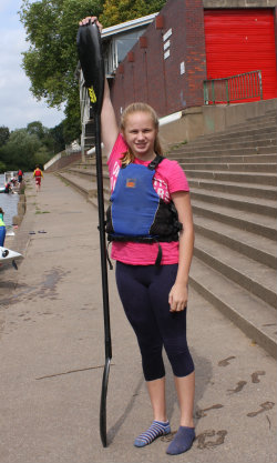 Paddler shows how long a paddle is