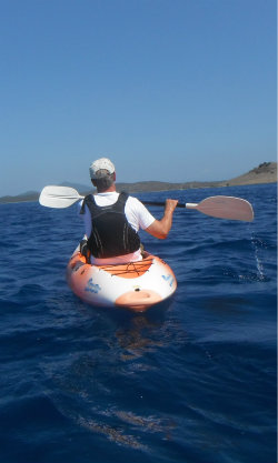 Paddler on Sit onTop Kayak in the sun