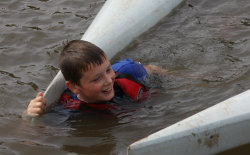 Capsized paddler wearing PFD