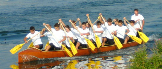 war canoe being paddled