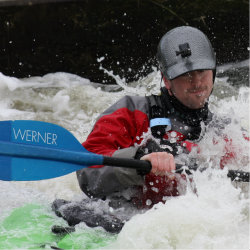 whitewater kayaker on the water